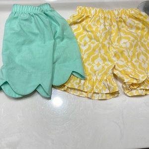 One Light Teal Scalloped Short and One Yellow and White Short with Ruffle